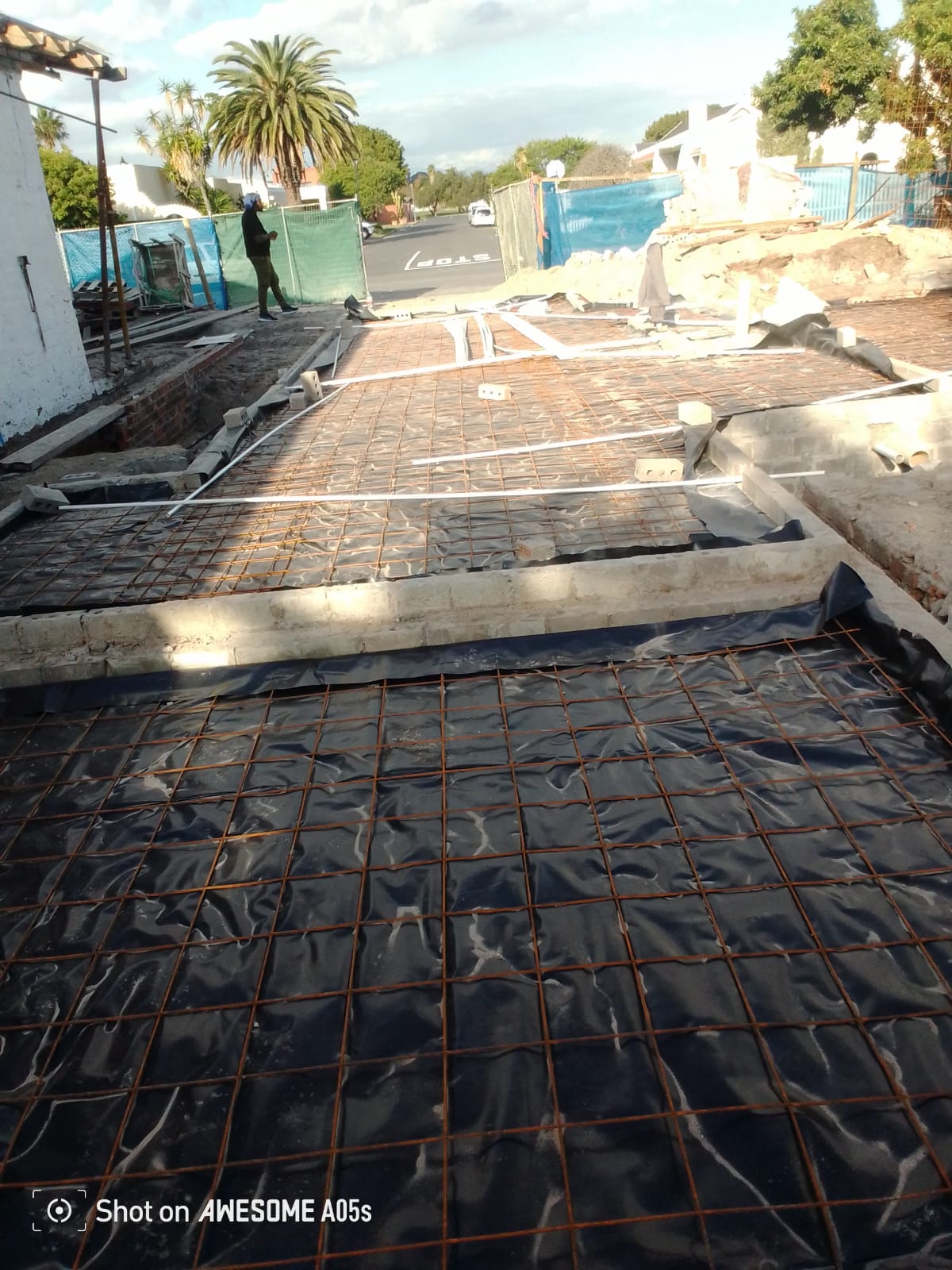 Rebar mesh on slab with conduit stub-ups for the electrical first fix